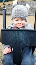 Portrait of smiling boy in snow