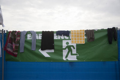 Clothes drying on clothesline against sky