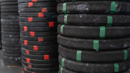 Close-up of stacked weights in gym