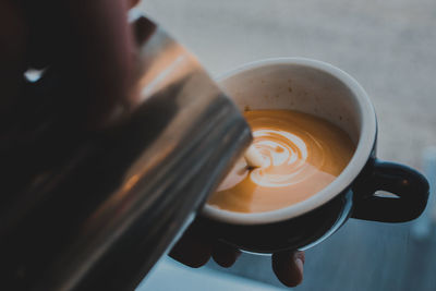 Close-up of coffee cup on table