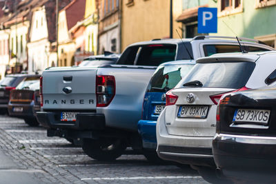 Cars parked on city street