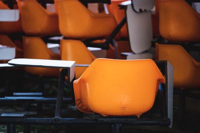 Close-up of empty chairs and table in cafe