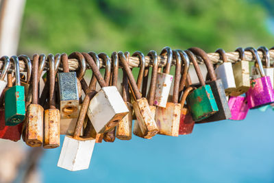 Close-up of padlocks hanging on metal