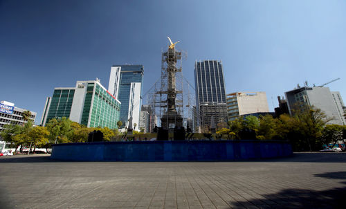 Modern buildings in city against sky