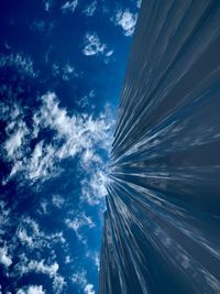 Low angle view of modern building against blue sky