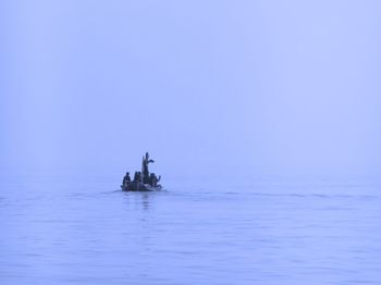 Scenic view of sea against blue sky