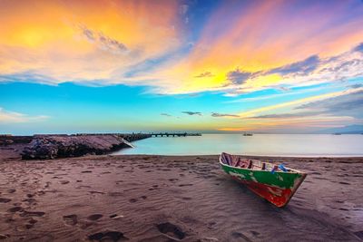 Scenic view of beach against sky during sunset