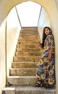 Full length of woman on staircase