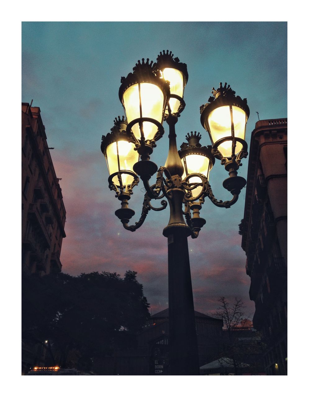 lighting equipment, street light, illuminated, street lamp, sky, outdoors, no people, low angle view, night, architecture, gas light, building exterior, tree