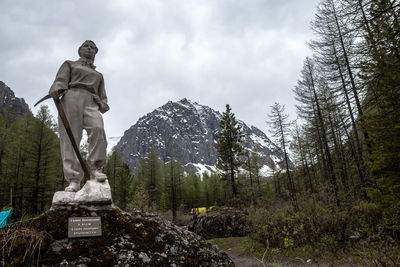 Low angle view of statue against sky