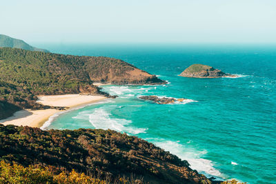 Scenic view of bay against clear sky