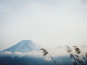 Scenic view of snow covered mountain against sky