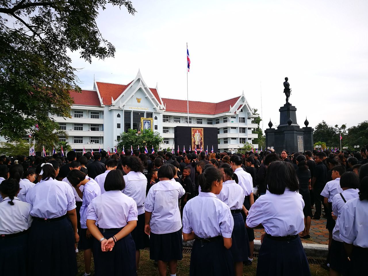 large group of people, building exterior, built structure, patriotism, flag, parade, architecture, celebration, military uniform, people, adults only, military parade, men, real people, adult, outdoors, day