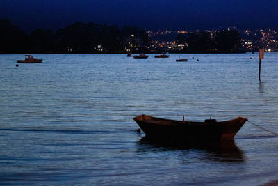 Boat in sea against sky