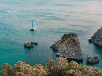 High angle view of sailboats in sea