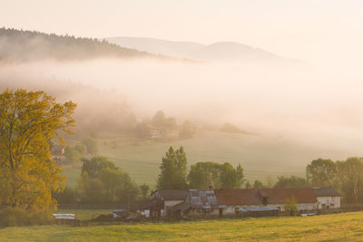 Farm in polerieka village in turiec region on a foggy morning.