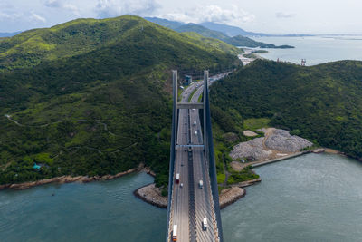 Bridge over river by mountains