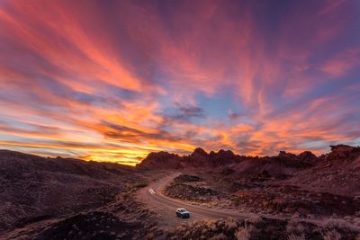 Scenic view of road against sky during sunset