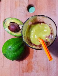 Green fruits on wooden table