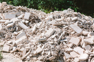 Stack of rocks against trees