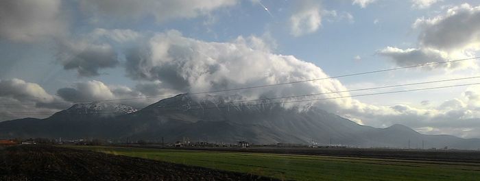 Panoramic view of landscape against storm clouds