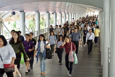 Group of people walking in corridor