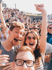 People cheering during football tournament