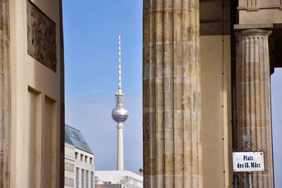 View of communications tower in city