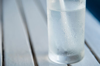 Close-up of condensed glass on table