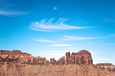 View of rock formations against blue sky