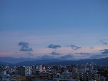 View of city against sky during sunset