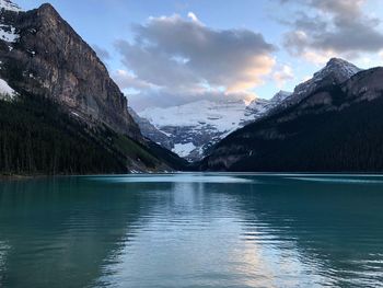 Scenic view of lake and mountains against sky