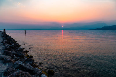 Scenic view of sea against sky during sunset