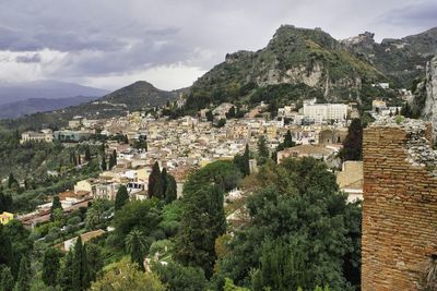 High angle view of townscape and trees against sky