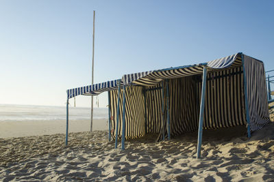 Scenic view of beach against blue sky