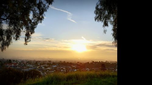 Scenic view of field against sky during sunset