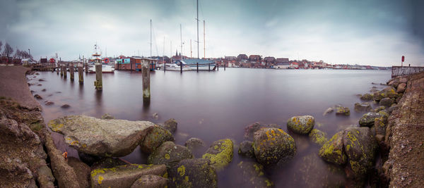 Panoramic view of bay against sky