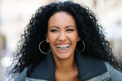 Close-up of cheerful woman with braces