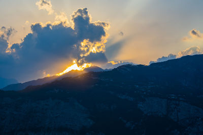 Scenic view of mountains against dramatic sky