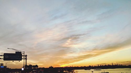 Silhouette cityscape against sky during sunset