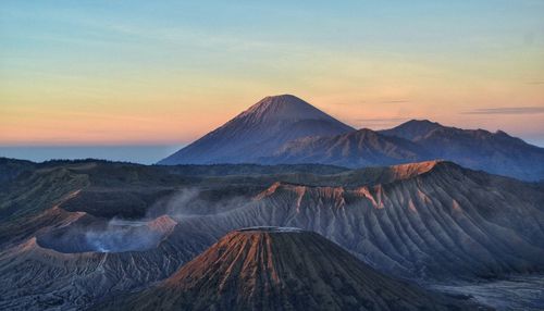 Scenic view of mountain range against sky during sunset