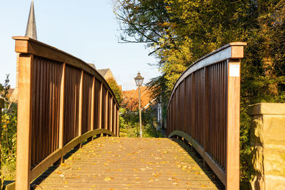 Bridge in park against sky