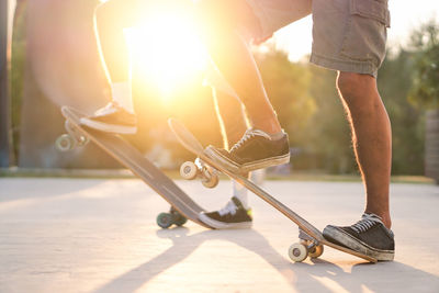 Low section of people skateboarding on skateboard park