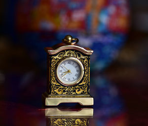 Close-up of clock on table