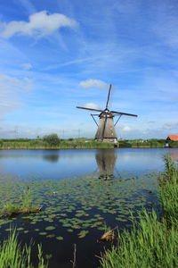 Traditional windmill against sky