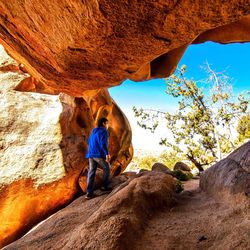 Woman standing on rock formation