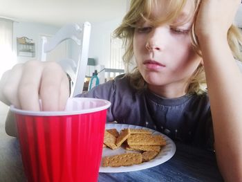 Close-up of cute girl eating food