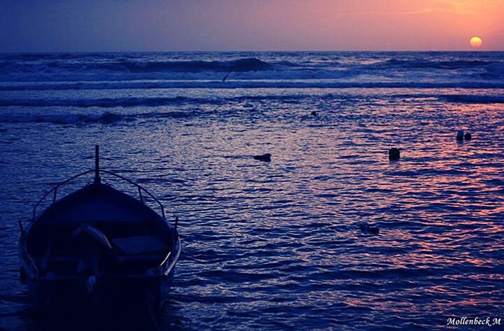 sea, water, sunset, horizon over water, scenics, tranquil scene, tranquility, beauty in nature, orange color, rippled, idyllic, nature, waterfront, sky, clear sky, nautical vessel, silhouette, sun, seascape, reflection