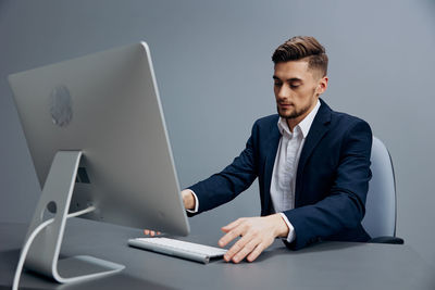 Businessman working at desk in office