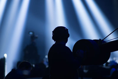 Silhouette people at music concert